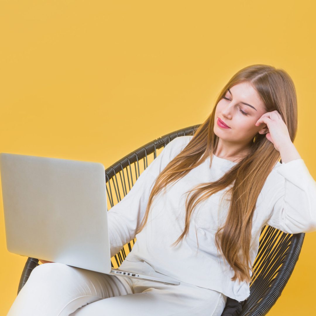 portrait-modern-woman-with-laptop-chair portrait-modern-woman-with-laptop-chair